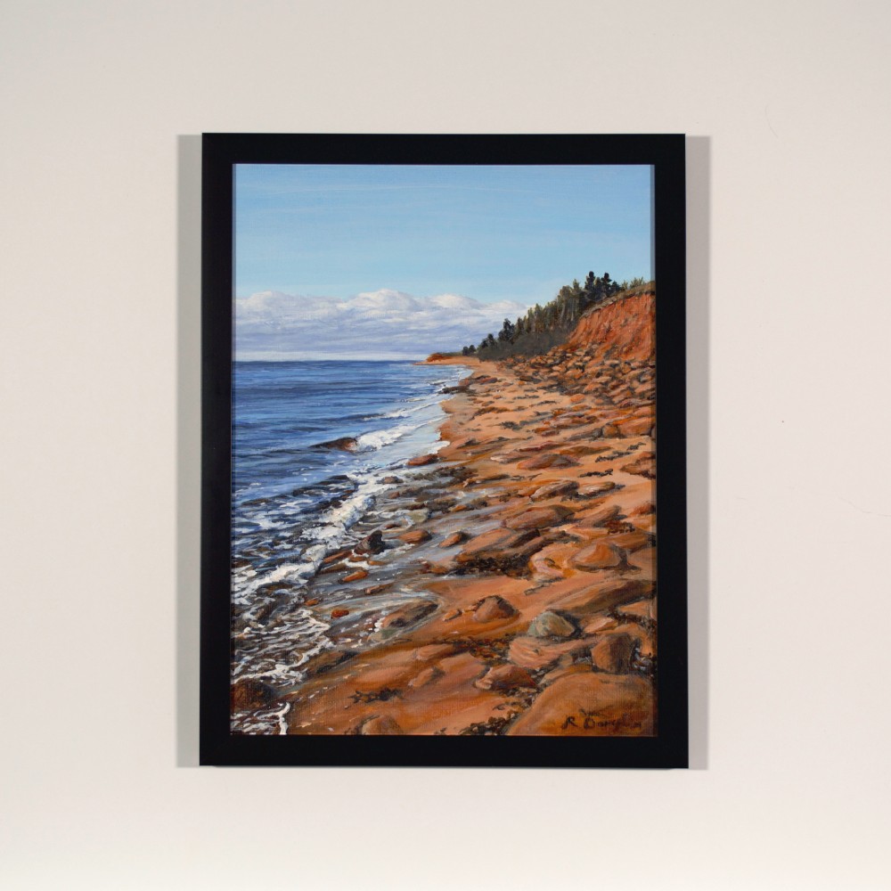 Landscape painting in simple black frame on a warm white wall.